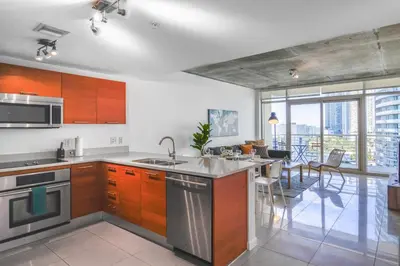 a kitchen with a sink and a counter top at Relax Family Midtown - free parking & Great pool in Miami