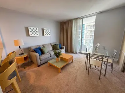 a living room with a couch and a table at MVR Apartments at Marenas in Miami Beach