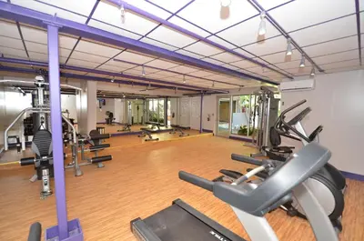 a gym with several treadmills and cardio machines at Sea Club Ocean Resort in Fort Lauderdale