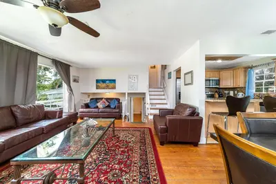 a living room with a couch and a table at Pool Home in Hollywood