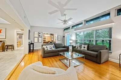 a living room with two couches and a table at Large home wking bed by PMI unit BH in Fort Lauderdale