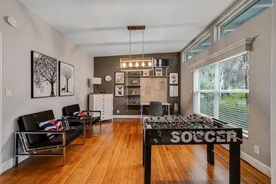 a living room with a table in the middle of a room at Large home wking bed by PMI unit BH in Fort Lauderdale