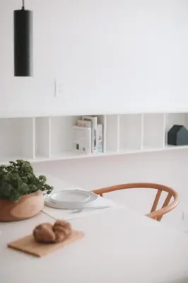 a kitchen counter with a plate of food on a table at Beach Haus Bal Harbour in Miami Beach