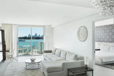 a living room with a couch and a table at Mondrian South Beach in Miami Beach
