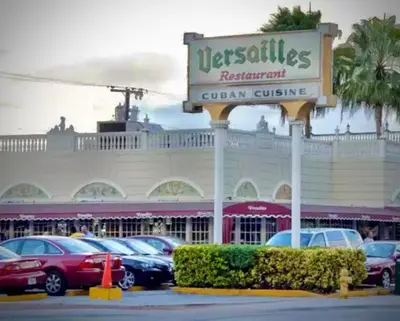 a car dealership with cars parked in a parking lot at Cozy Private House near Miami Airport - Free parking - 01 in Miami