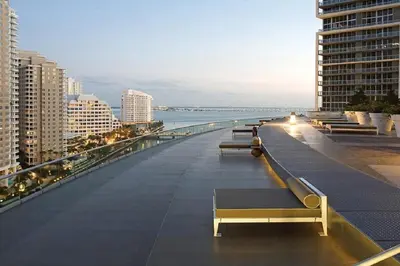 a row of benches on the roof of a building at ICONIC LUXURIOUS HIGH CEILINGS UNIT BRICKELL w in Miami