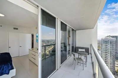 an apartment balcony with a view of a city at Majestic High Rise Unit with Ocean view in Miami