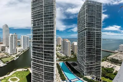 an aerial view of two tall skyscrapers in a city at Majestic High Rise Unit with Ocean view in Miami