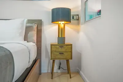 a lamp on a night stand next to a bed at Splendid Unit outstanding View-W Hotel Brickell in Miami