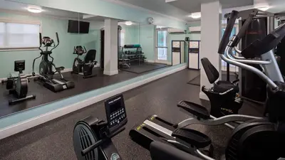 a gym with treadmills and elliptical machines at Best Western Plus Oceanside Inn in Fort Lauderdale