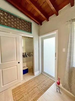 a room with a door and a red chair in it at Taste of Miami Vive in Miami