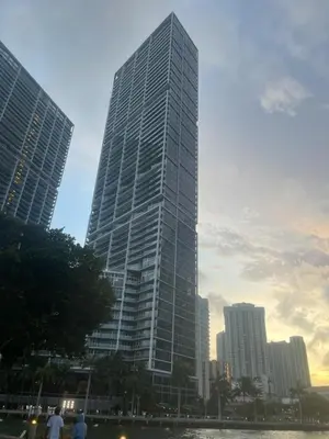 a tall glass building in a city at IconBrickell Tower 3 W Residences in Miami
