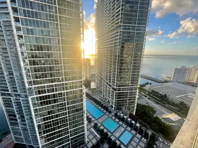 a view of two tall skyscrapers in a city at IconBrickell Tower 3 W Residences in Miami