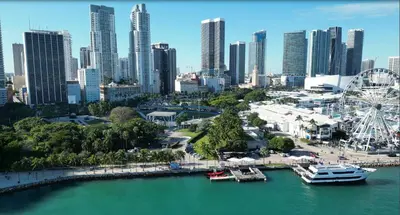 a city skyline with a ferris wheel and a harbor at Gorgeous Private Room, near the Airport - Free parking - 01 in Miami