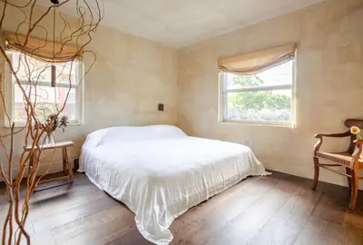 a bedroom with a white bed and a window at Casa Ishi - at lumicollection in Miami