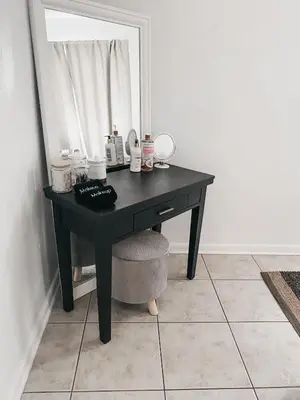 a black desk in a room with a mirror at Lovely Bohemian Apartment in Fort Lauderdale