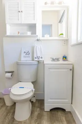 a white bathroom with a toilet and a sink at MIAMI PARADISE in Miami
