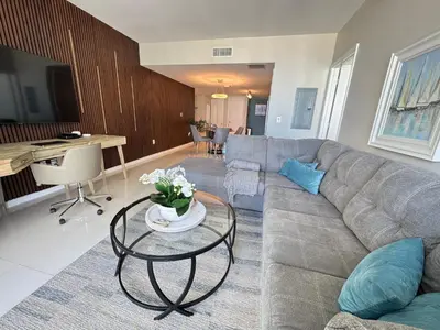 a living room with a couch and a table at Sun&Sea IconBrickell Unit in Miami
