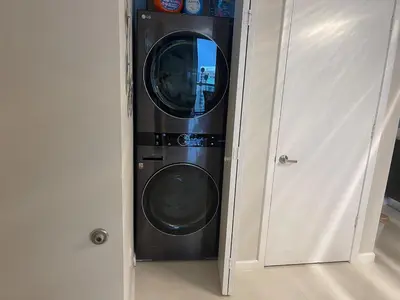 a washer and dryer sitting in a room at Sun&Sea IconBrickell Unit in Miami