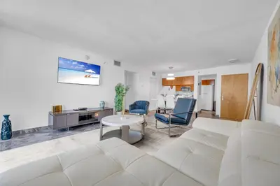 a living room with a white couch and a table at LUXURY 3 Bedrooms BRICKELL BAY APARTMENT in Miami