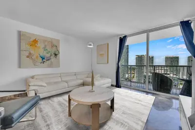 a living room with a couch and a table at LUXURY 3 Bedrooms BRICKELL BAY APARTMENT in Miami