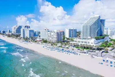 an aerial view of a beach in front of a city at W Residences 2 Bedroom Suite condo in Fort Lauderdale