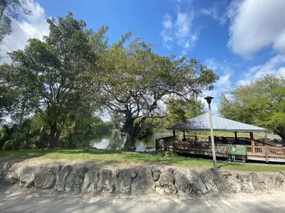 a building with a gazebo next to a waterfall at LYZ Miami in Miami