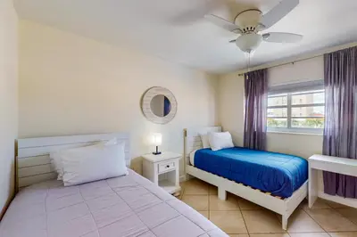 a bedroom with two beds and a window at Samira's South Beach Paradise in Miami Beach