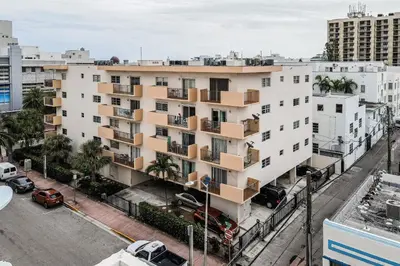 an apartment building with balconies on a city street at Samira's South Beach Paradise in Miami Beach
