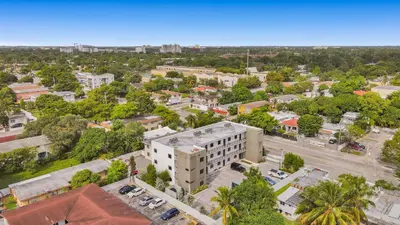an aerial view of a city with a building at Renzzi Wynwood Apartments in Miami