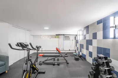 a room with a gym with a bike and weights at PRAIA Hotel Boutique & Apartments Miami Beach in Miami Beach