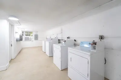 a large white room with white appliances in it at PRAIA Hotel Boutique & Apartments Miami Beach in Miami Beach