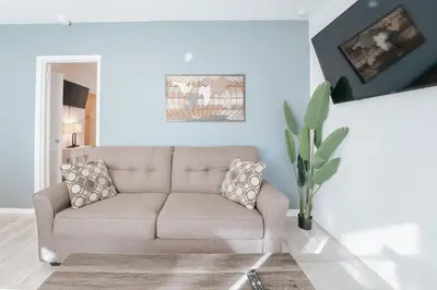 a living room with a couch and a plant at PRAIA Hotel Hollywood in Hollywood