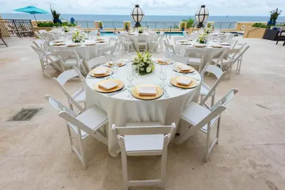 a group of tables and chairs with the ocean in the background at The Atlantic Hotel & Spa in Fort Lauderdale