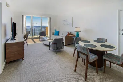 a living room with a table and chairs and a living room at The Atlantic Hotel & Spa in Fort Lauderdale