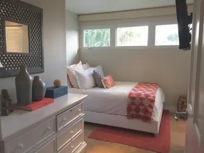 a bedroom with a bed with a dresser and a window at Villa Naomi - Luxury Design New Home in Miami