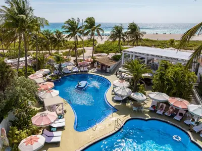 an aerial view of a resort with a pool and beach at The Savoy Hotel & Beach Club in Miami Beach