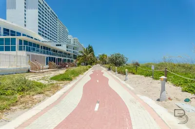a red brick road in front of a building at Girasole Rentals Suites in Miami Beach