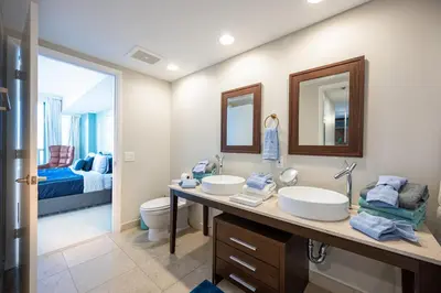 a bathroom with two sinks and a toilet at Inredible View -Luxury Unit at the W Brickell in Miami