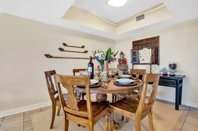 a dining room with a wooden table and chairs at NEW Amazing large 3BR direct oceanfront Penthouse On Ocean Drive!! in Miami Beach