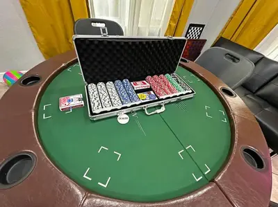 a poker table with a laptop on top of it at Escape GameRoom, BAR, BBQ, Spacious,KING Bed, All Luxury mattresses, Near Beach, 6 blocks away from Bars, Nite Clubs, Res, Shops in Miami