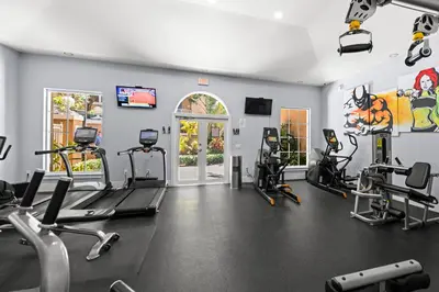 a gym with treadmills and ellipticals in a room at Yacht Club Miami Suite 2 Bedroom and 2 Bathroom With Baby Crib & Free Parking in Miami