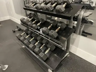 a bunch of dumbbells in a gym at Yacht Club Miami Suite 2 Bedroom and 2 Bathroom With Baby Crib & Free Parking in Miami