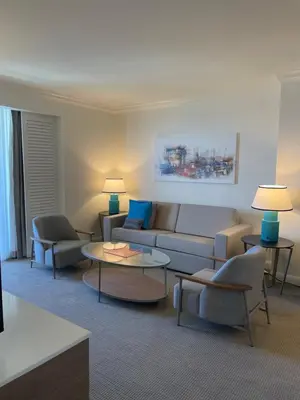 a living room with a couch and chairs and tables at The Atlantic Hotel & Spa Condo in Fort Lauderdale