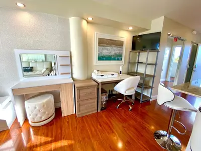 a home office with a desk and chairs in a room at Modern waterfront apartment with Miami Skyline view, free parking 5 mins drive to Miami Beach in Miami Beach