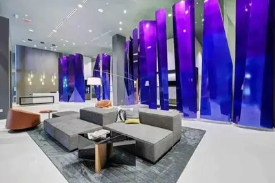 a living room with a couch and a purple wall at LUXURY 1 BDRM/1B APT IN MIAMI DESIGN DISTRICT AREA in Miami