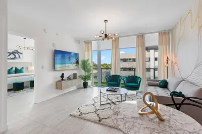 a living room with a couch and a table at LUXURY 1 BDRM/1B APT IN MIAMI DESIGN DISTRICT AREA in Miami