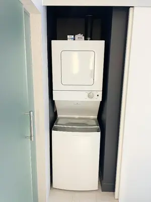 a white refrigerator with a microwave on top of it at Luxury 1 BR at Fort Lauderdale in Fort Lauderdale
