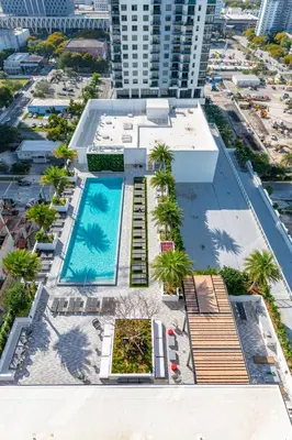 an aerial view of a building with a swimming pool at Global Luxury Suites Miami Worldcenter in Miami