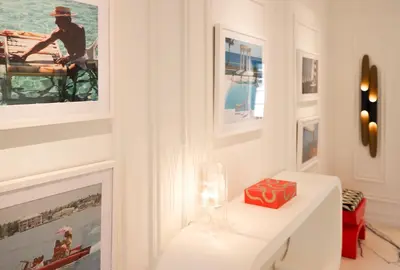 a white room with a table with a red box on it at Uma House by Yurbban South Beach in Miami Beach